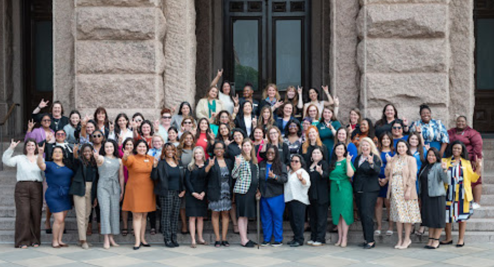 The fourth cohort of the LBJ Women's Campaign School gather on the steps of the Texas Capitol in Austin.
