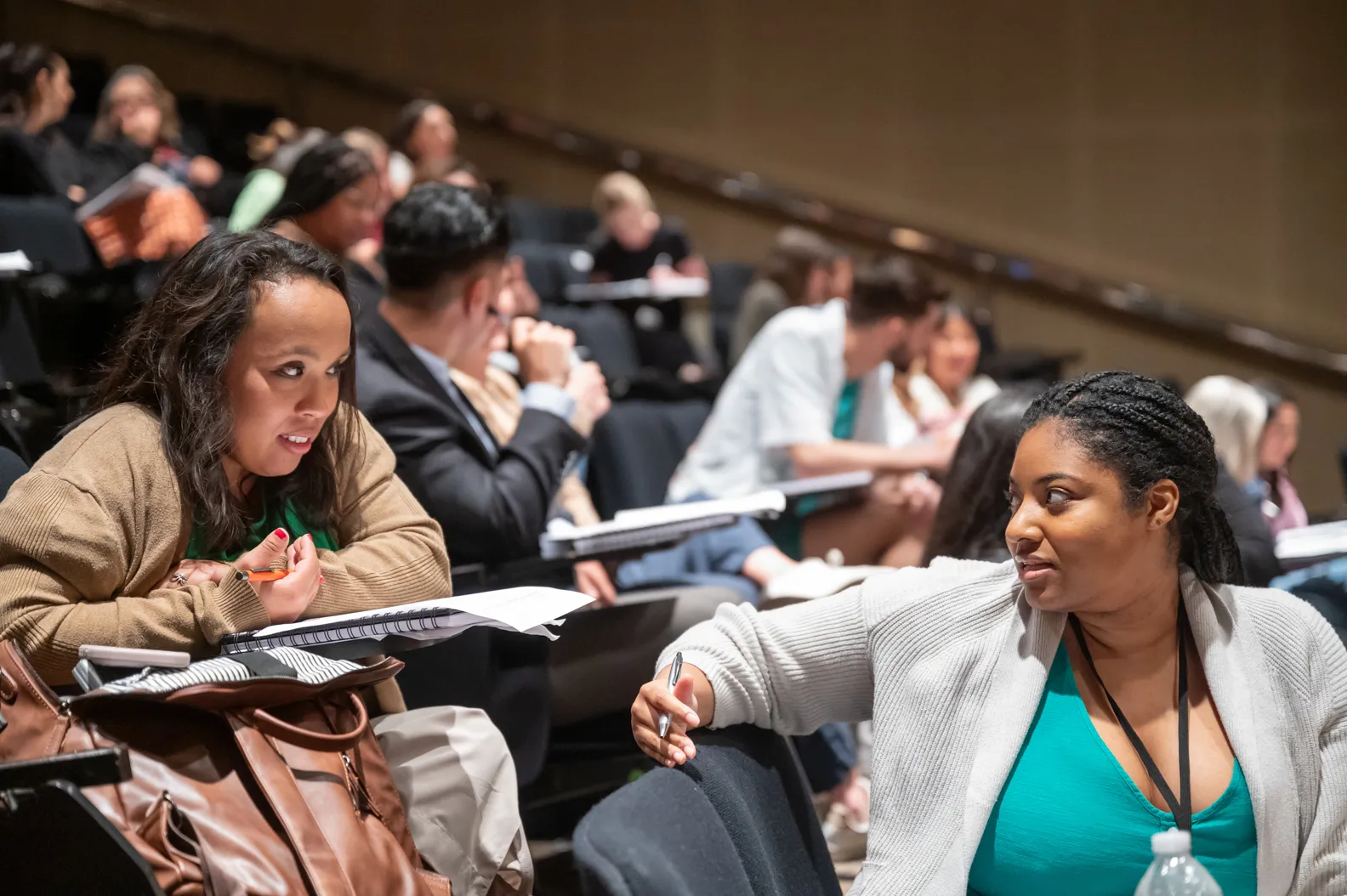 LBJWCS cohort members Maria Florentina "Masi" Mejia and Ameena Rasheed simulate campaign staff members responding to an urgent crisis during a training session on campaign finance.